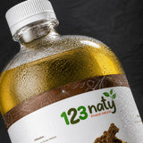 Pack  1L Huile de Costus Indien & 1kg Costus Indien Brut | 123NATY — Détail macro du flacon